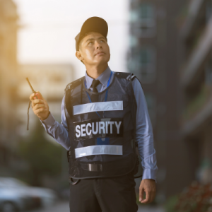 security-man-standing-outdoors-using-portable-radio