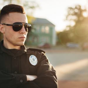 serious-male-cop-uniform-sunglasses